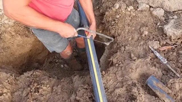 Aligning Repaired Sewer Line In Trench shown for Sewer Line Repair vs. Replacement: What Actually Decides It in Dallas, Georgia.
