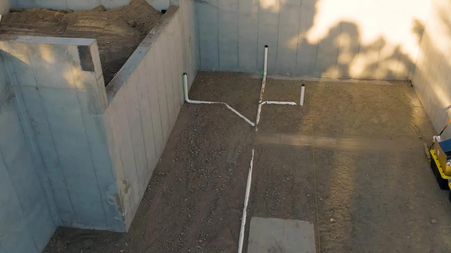 Basement Drain Lines Beneath Wood Frame shown for Is a Slow Drain an Emergency on a Dallas, GA Septic System? in Dallas, Georgia.