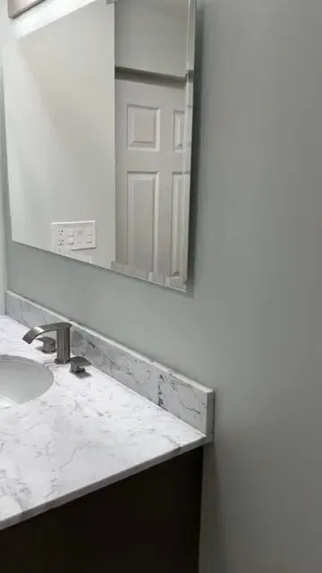 Bathroom Vanity And Toilet After Remodel shown for Toilet Repair & Installation in Dallas, GA in Dallas, Georgia.