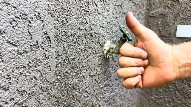 Checking Hose Bib Handle After Repair shown for Faucet Repair & Installation in Dallas, GA in Dallas, Georgia.
