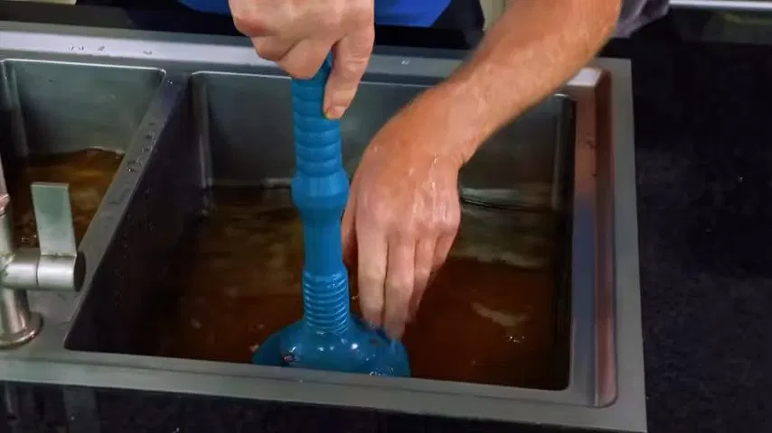 Clogged Kitchen Drain Seen Through Strainer shown for Opening a Restaurant Along Dallas, GA's Highway 61 Corridor: What to Check First in Dallas, Georgia.