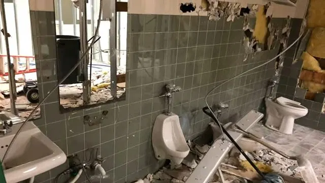 Commercial Restroom Wall Demolition With Urinals shown for Contact Plumbing Pros Dallas GA in Dallas, Georgia.