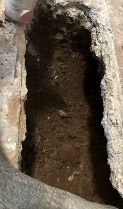 Concrete Slab Trench Beside Pipe shown for Leak Detection in Dallas, GA in Dallas, Georgia.