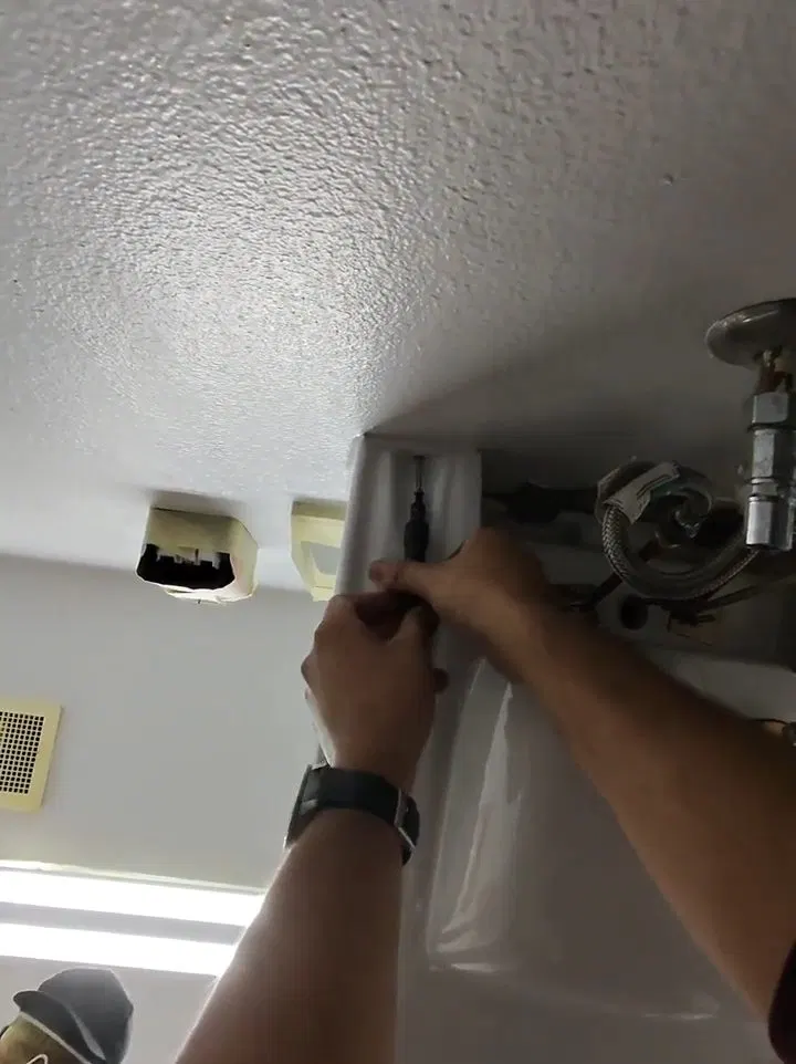 Contractor Installing Restroom Ceiling Drain shown for Opening a Restaurant Along Dallas, GA's Highway 61 Corridor: What to Check First in Dallas, Georgia.