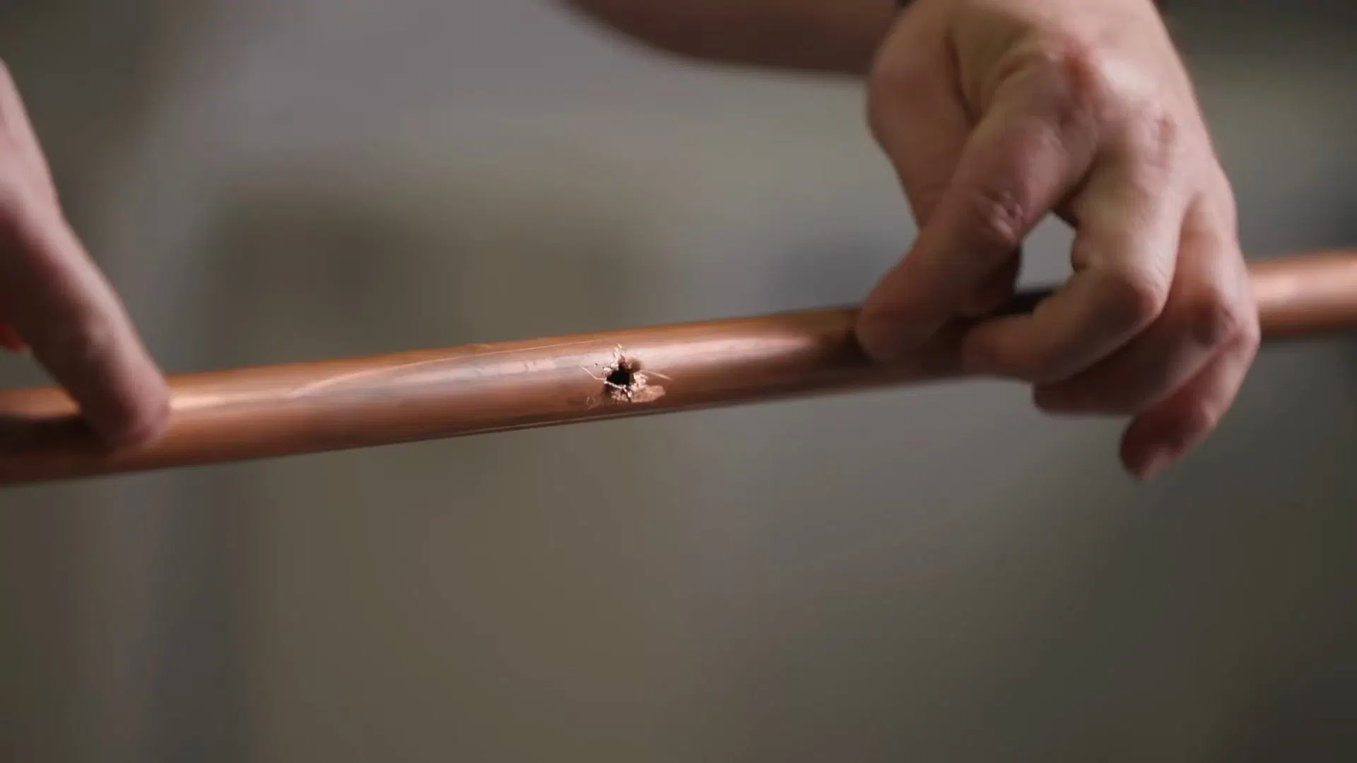 Copper Pipe Repair Section In Hand shown for Burst & Broken Pipe Repair in Dallas, GA in Dallas, Georgia.