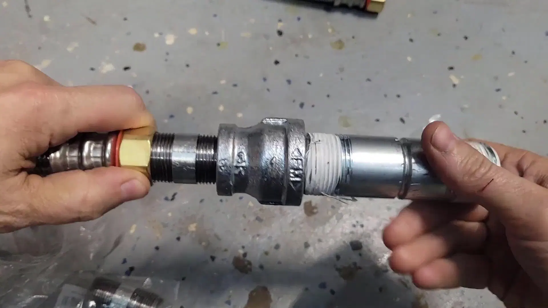 Coupling Connecting Gas Water Heater Pipes shown for Gas Line Installation & Repair in Dallas, GA in Dallas, Georgia.