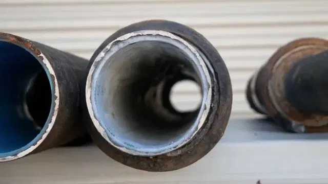 Coupling New Lined Pipe To Old Cast Iron shown for Plumber in Hiram, GA in Hiram, Georgia.