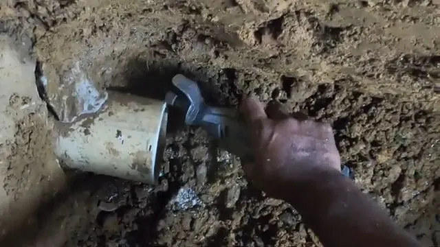 Cutting Damaged Sewer Pipe In Excavation shown for Plumbing guides for Dallas and Paulding County in Dallas, Georgia.