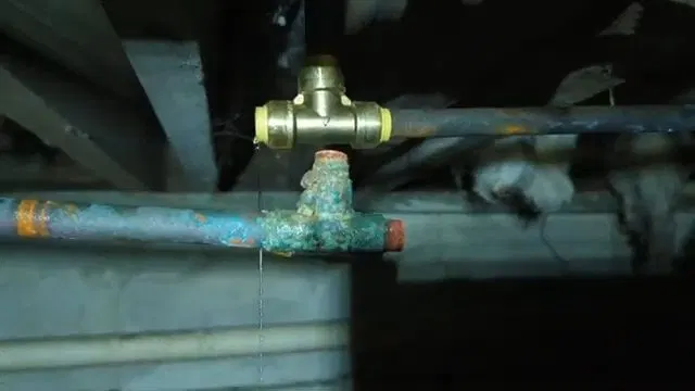 Cutting Frozen Copper Pipe Near Foundation shown for Burst & Broken Pipe Repair in Dallas, GA in Dallas, Georgia.
