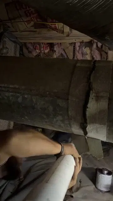 Cutting Old Cast Iron Drain In Crawlspace shown for Drain Cleaning in Dallas, GA in Dallas, Georgia.