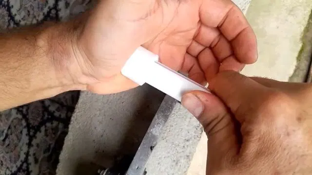 Cutting White PEX Repair Tube To Length shown for Slab Leak Detection & Repair in Dallas, GA in Dallas, Georgia.
