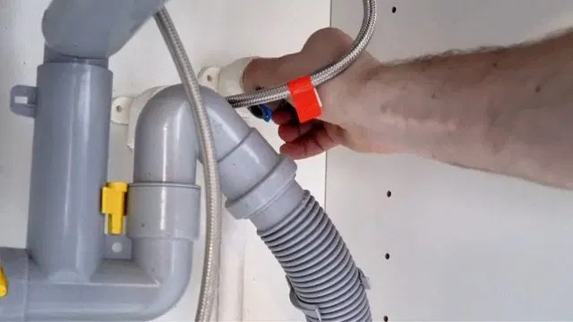 Disconnecting Sink Faucet Supply And Drain Lines shown for Should a Dallas, GA Home on Septic Even Have a Garbage Disposal? in Dallas, Georgia.