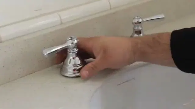 Disconnecting Toilet Tank Bolts shown for A Running Toilet on a Septic System: What It's Actually Costing You in Dallas, Georgia.