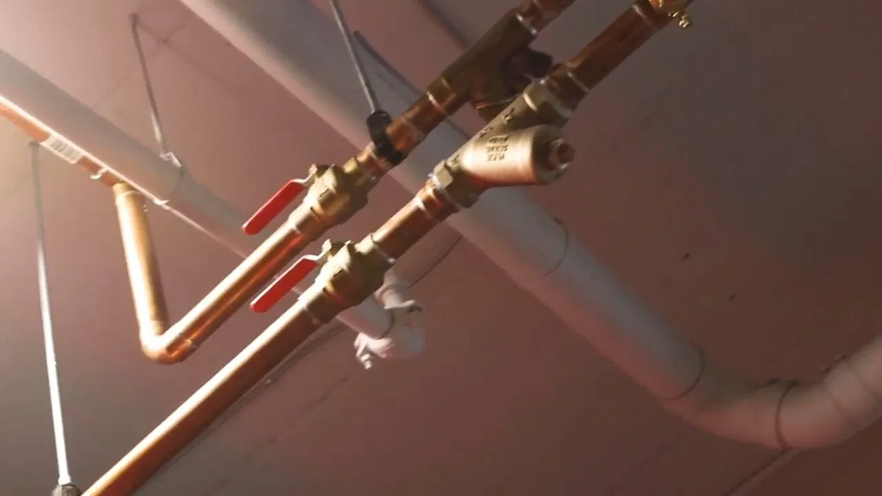 Exposed Gym Ceiling Plumbing Rough In shown for A Running Toilet on a Septic System: What It's Actually Costing You in Dallas, Georgia.