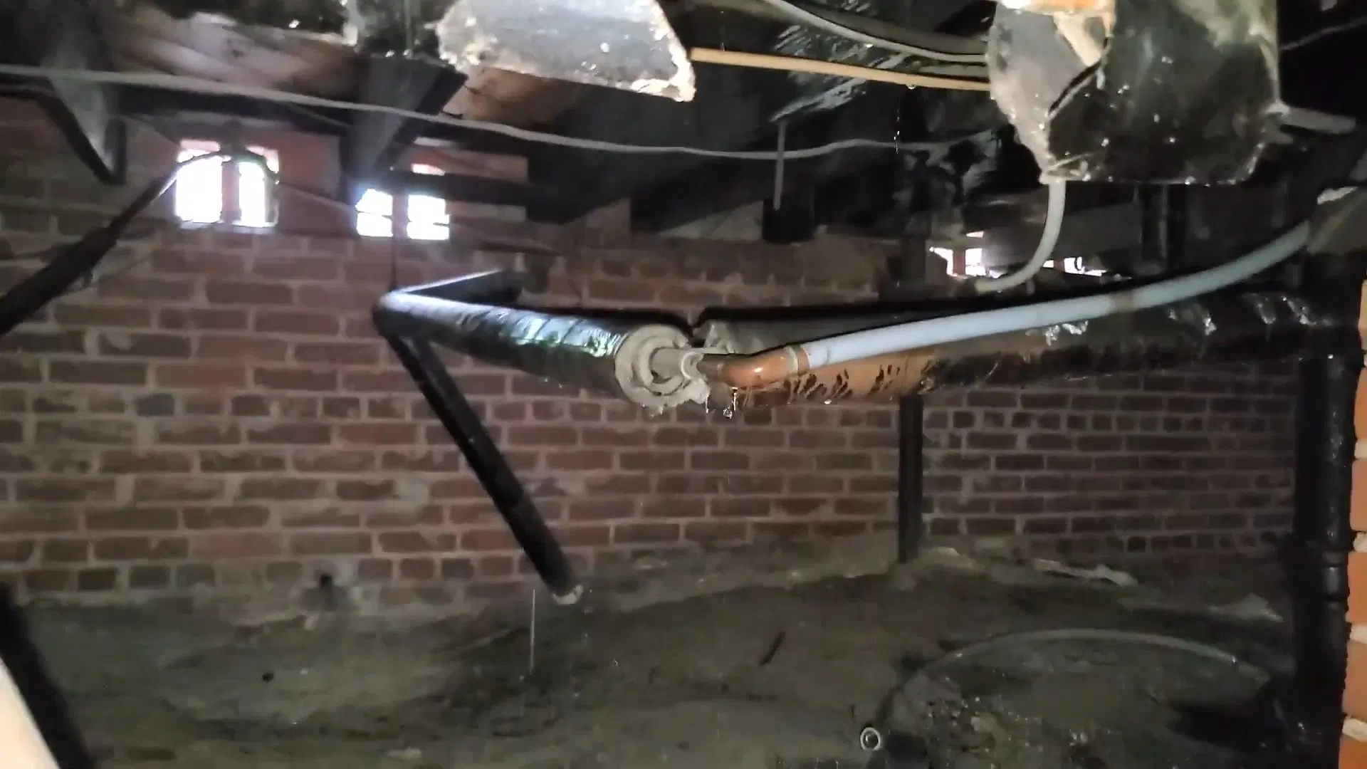Exposed Old Plumbing Below Crawlspace shown for Natural Gas or Propane? What Actually Determines It for a Dallas, GA Home in Dallas, Georgia.