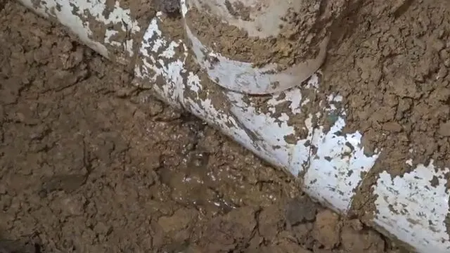 Exposed PVC Sewer Elbow In Trench shown for Areas we serve near Dallas, GA in Dallas, Georgia.