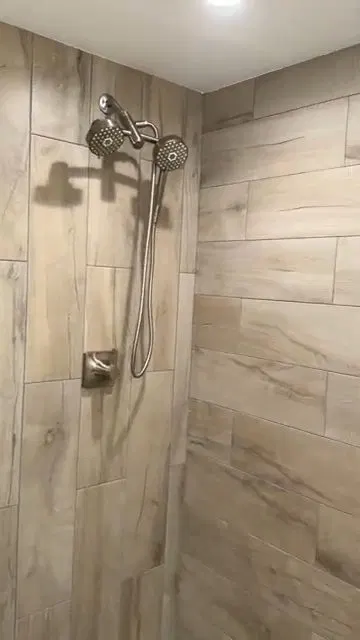 Finished Shower With Glass Door And Tiles shown for Plumbing guides for Dallas and Paulding County in Dallas, Georgia.
