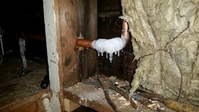 Frozen Copper Elbow Near Wall Insulation shown for Burst & Broken Pipe Repair in Dallas, GA in Dallas, Georgia.
