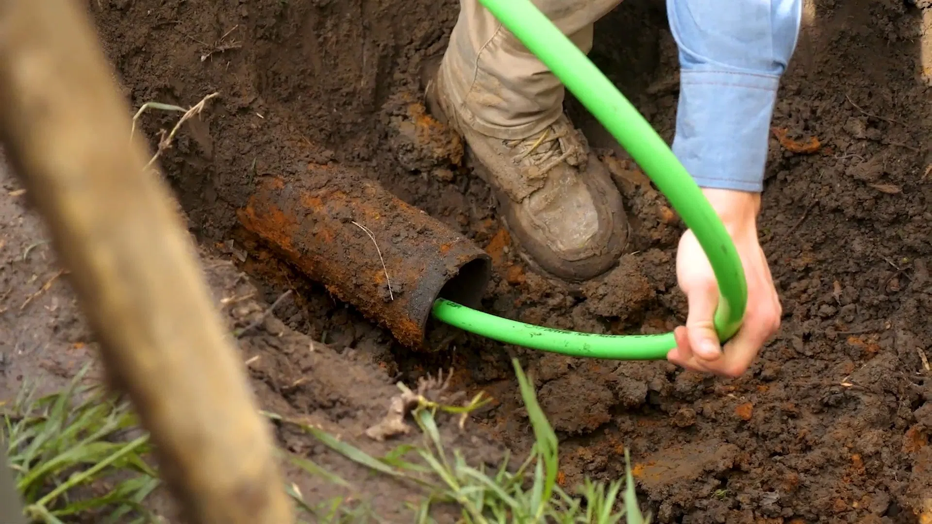 Green Liner Tube In Sewer Excavation shown for What Size Water Heater Does a Dallas, GA Household Actually Need? in Dallas, Georgia.