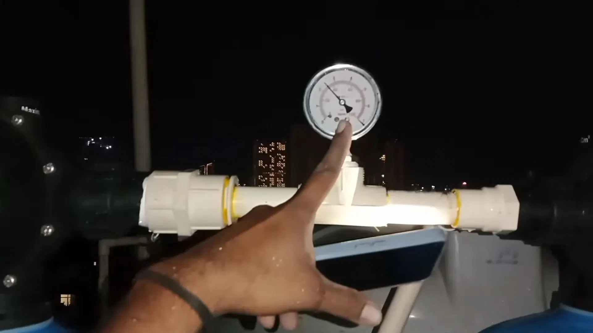 Hand Adjusting Softener Pressure Gauge shown for Is Dallas, GA's Water Actually Hard Enough to Need a Softener? in Dallas, Georgia.