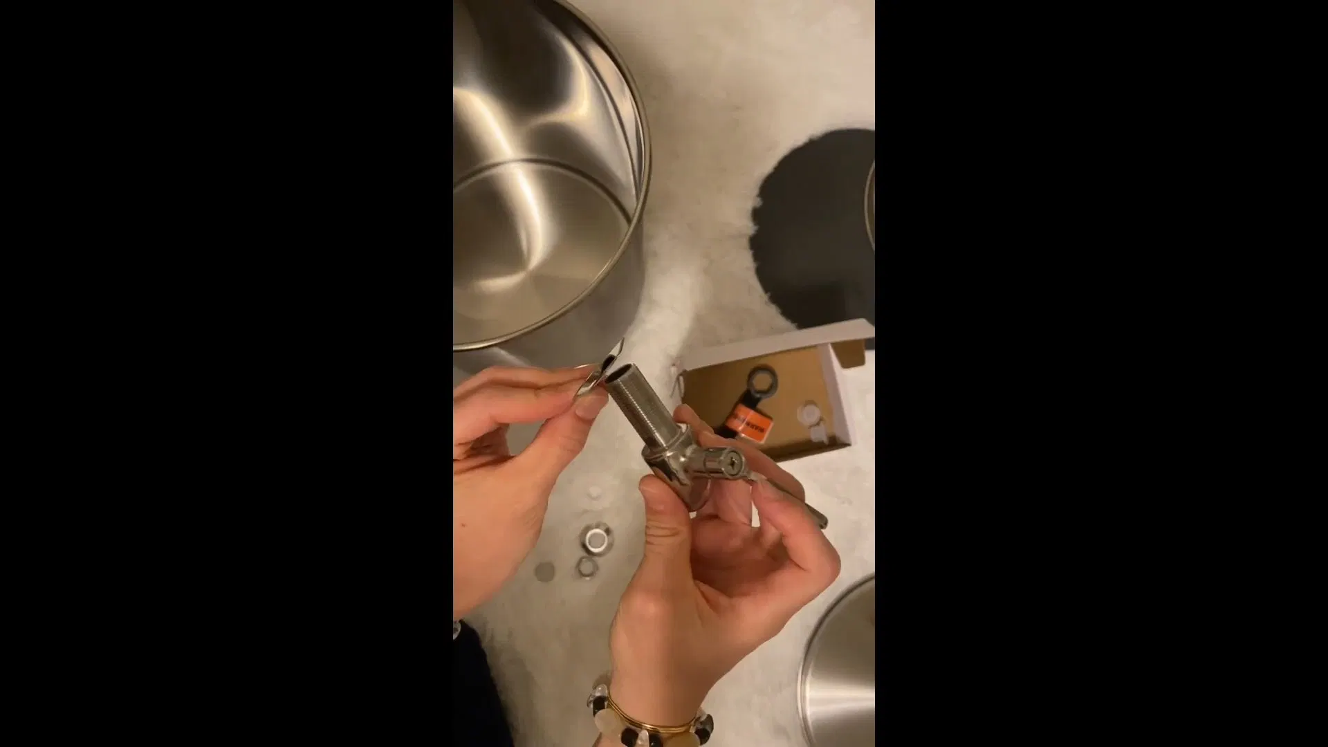 Hand Assembling Gravity Water Filter Spigot shown for Water Softener Installation & Repair in Dallas, GA in Dallas, Georgia.
