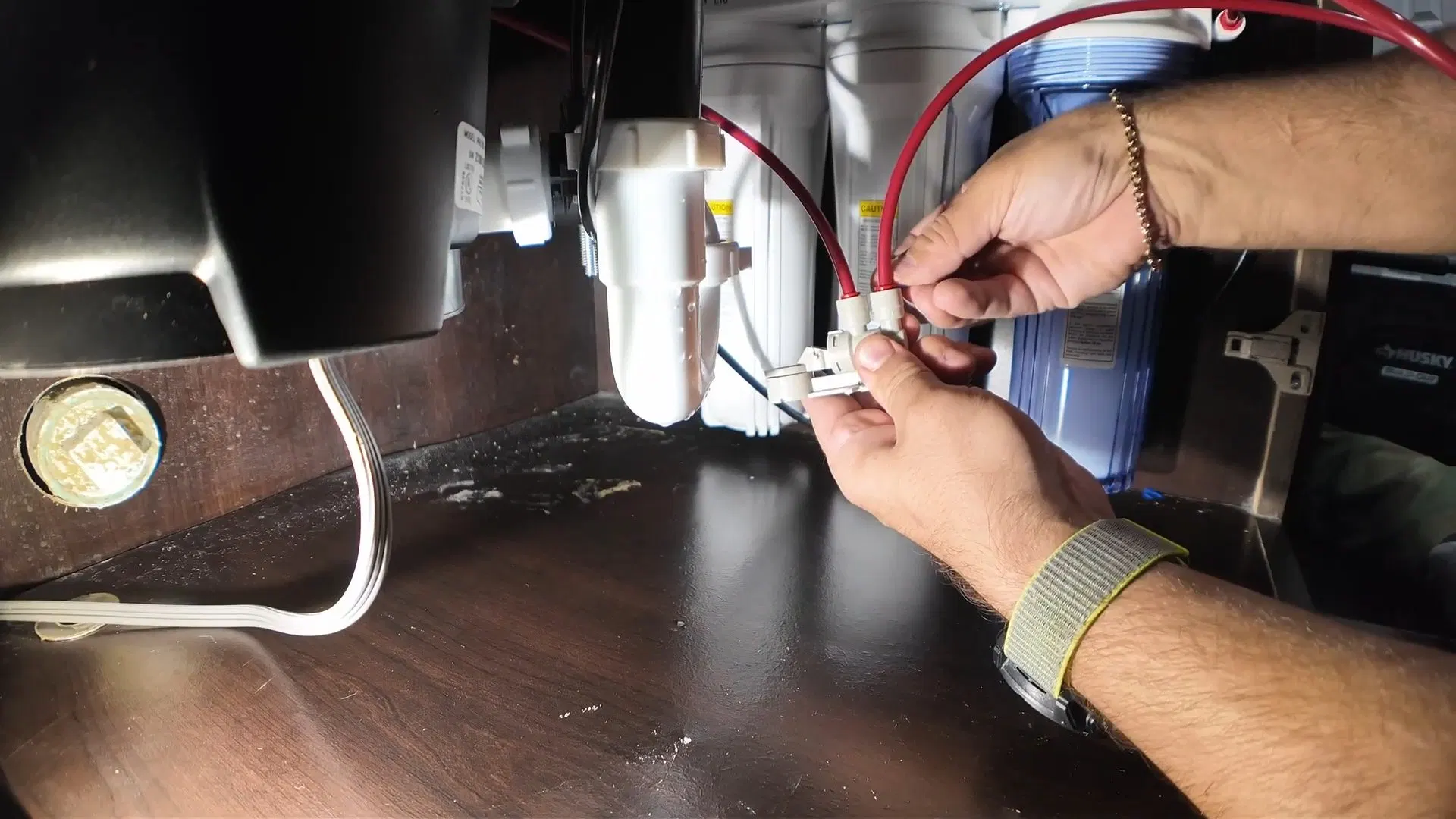 Hand Connecting Garbage Disposal Wires shown for Garbage Disposal Repair & Installation in Dallas, GA in Dallas, Georgia.