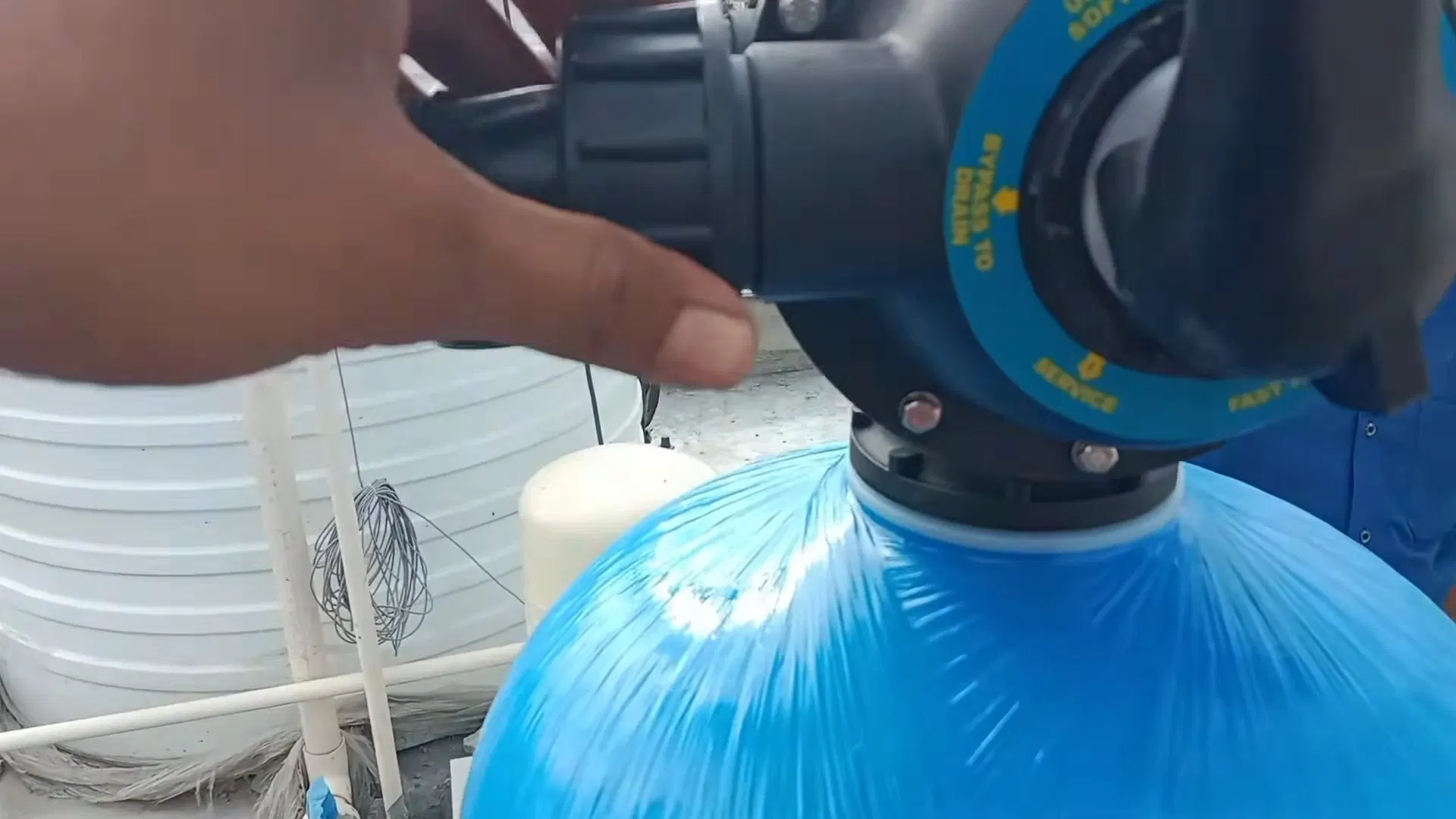 Hand Connecting Softener Blue Pipe shown for Is Dallas, GA's Water Actually Hard Enough to Need a Softener? in Dallas, Georgia.