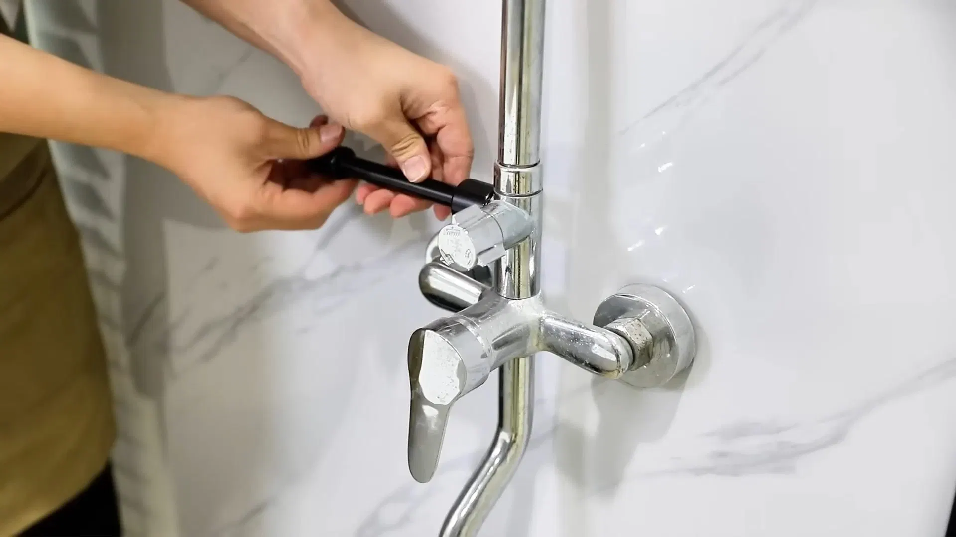 Hand Demonstrating Wall Mount Faucet shown for What Size Water Heater Does a Dallas, GA Household Actually Need? in Dallas, Georgia.