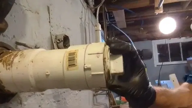 Home Inspector Opening Sewer Cleanout Cap shown for Natural Gas or Propane? What Actually Determines It for a Dallas, GA Home in Dallas, Georgia.