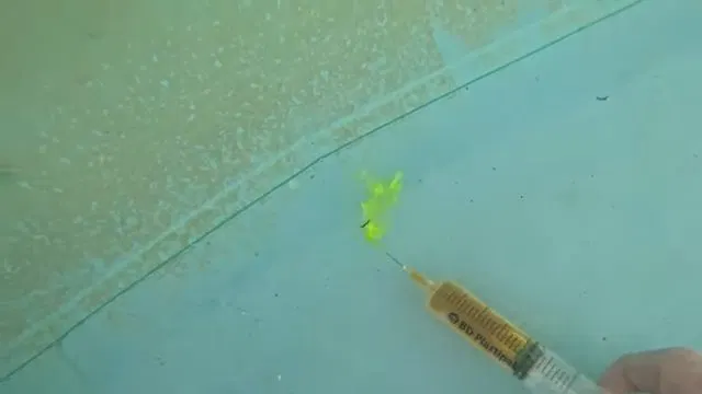 Injecting Dye Along Vinyl Pool Liner Seam shown for What Size Water Heater Does a Dallas, GA Household Actually Need? in Dallas, Georgia.