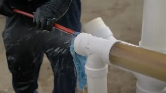 Inserting Hydro Jetting Hose Into PVC Pipe shown for Hydro Jetting in Dallas, GA in Dallas, Georgia.