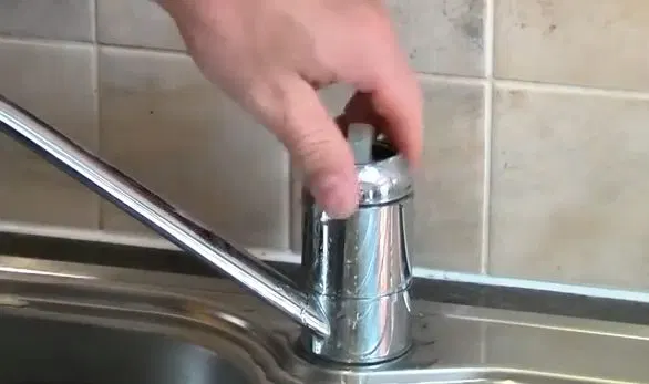 Inspecting Faucet Valve Body Openings shown for What Size Water Heater Does a Dallas, GA Household Actually Need? in Dallas, Georgia.