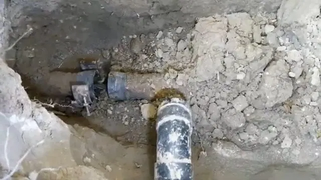 Joining Trenchless Sewer Pipe At Excavation shown for How Long Should a Water Heater Actually Last in Dallas, GA? in Dallas, Georgia.