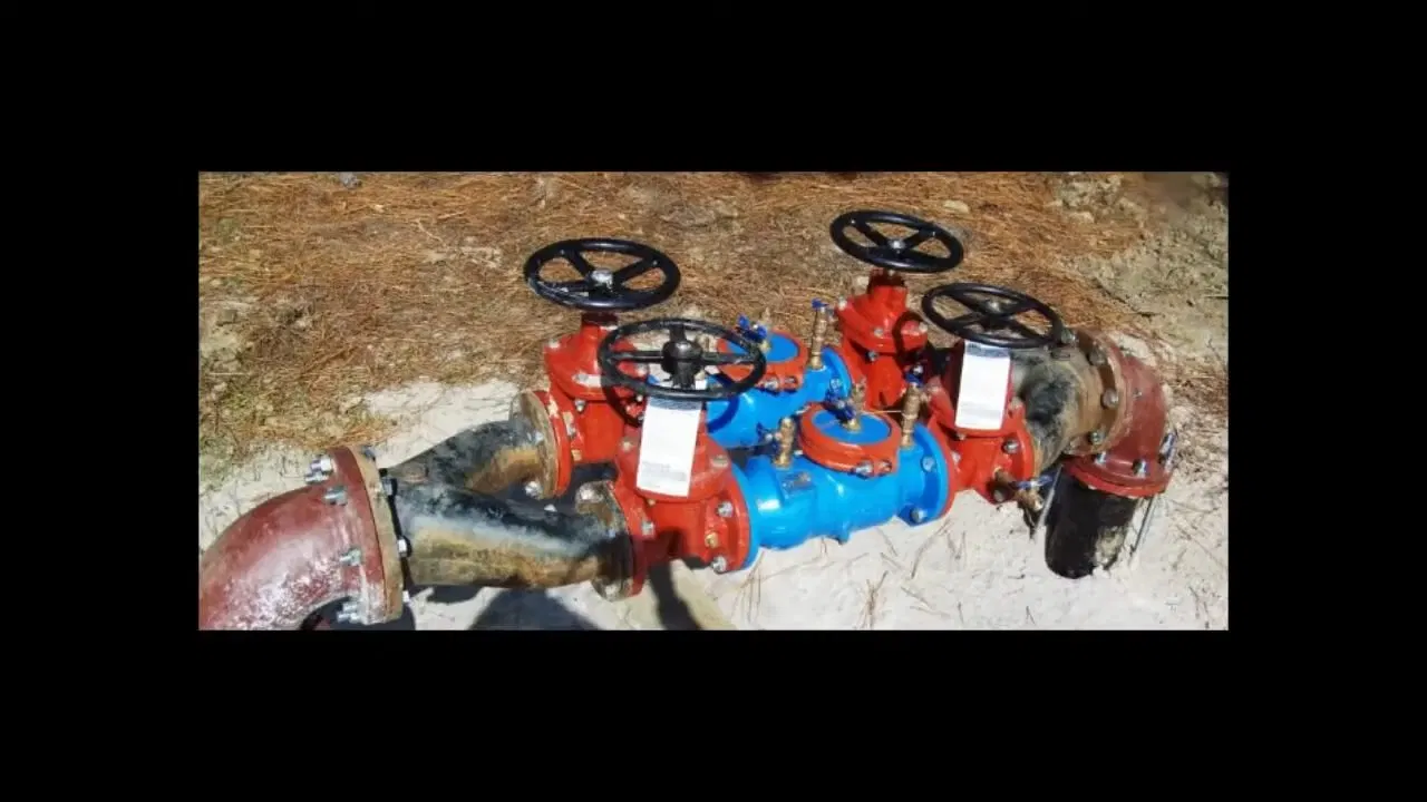 Large Red Commercial Backflow Preventer shown for Commercial Plumbing in Dallas, GA in Dallas, Georgia.