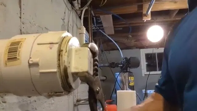 Loosening Sewer Cleanout With Channel Locks shown for Sewer Line Repair vs. Replacement: What Actually Decides It in Dallas, Georgia.