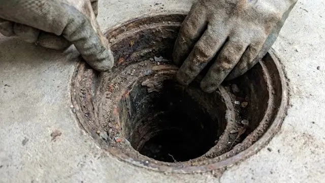Loosening Sink P Trap With Wrench shown for Should a Dallas, GA Home on Septic Even Have a Garbage Disposal? in Dallas, Georgia.