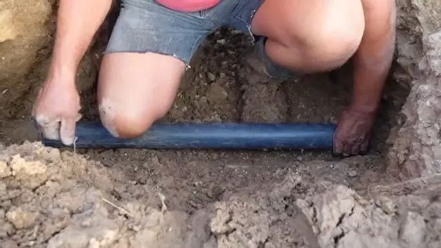 Measuring Burst Water Line In Excavation shown for The First Five Minutes of a Burst Pipe in a Dallas, GA Home in Dallas, Georgia.