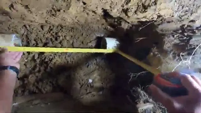 Measuring Exposed Sewer Pipe Gap shown for Sewer Line Repair vs. Replacement: What Actually Decides It in Dallas, Georgia.