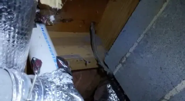 Measuring Pipe Clearance Inside Crawlspace shown for Repiping in Dallas, GA in Dallas, Georgia.