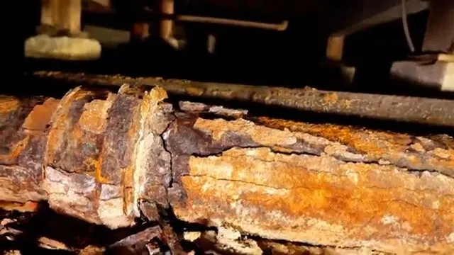 Measuring Rusted Cast Iron Pipe Before Cutting shown for Sewer Line Repair vs. Replacement: What Actually Decides It in Dallas, Georgia.