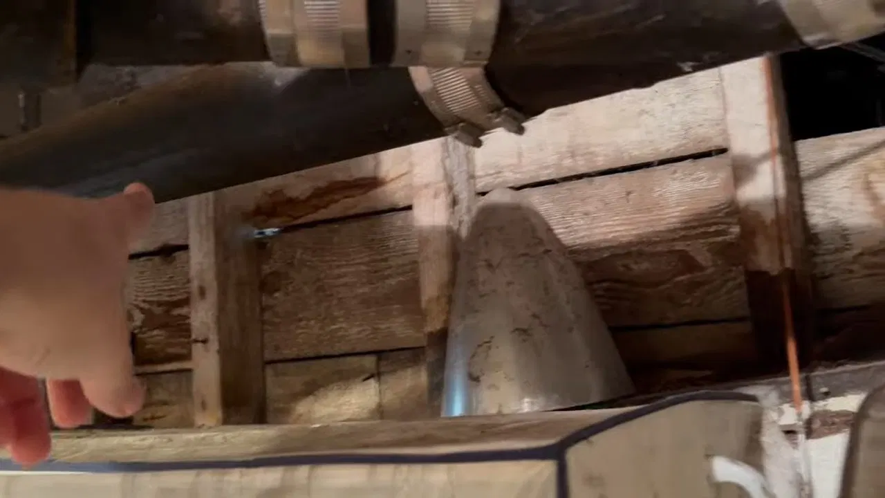Old Cast Iron Drain Beneath Wood Floor shown for Drain Cleaning in Dallas, GA in Dallas, Georgia.