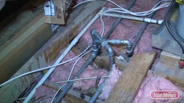 Old Copper Plumbing Manifold In Attic shown for Leak Detection in Dallas, GA in Dallas, Georgia.