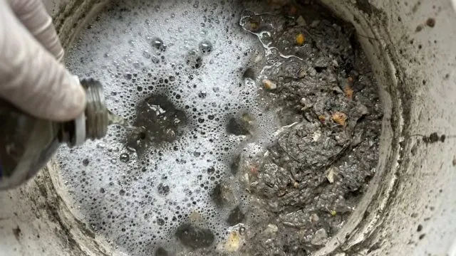Opening Old Floor Drain Cover By Hand shown for Opening a Restaurant Along Dallas, GA's Highway 61 Corridor: What to Check First in Dallas, Georgia.