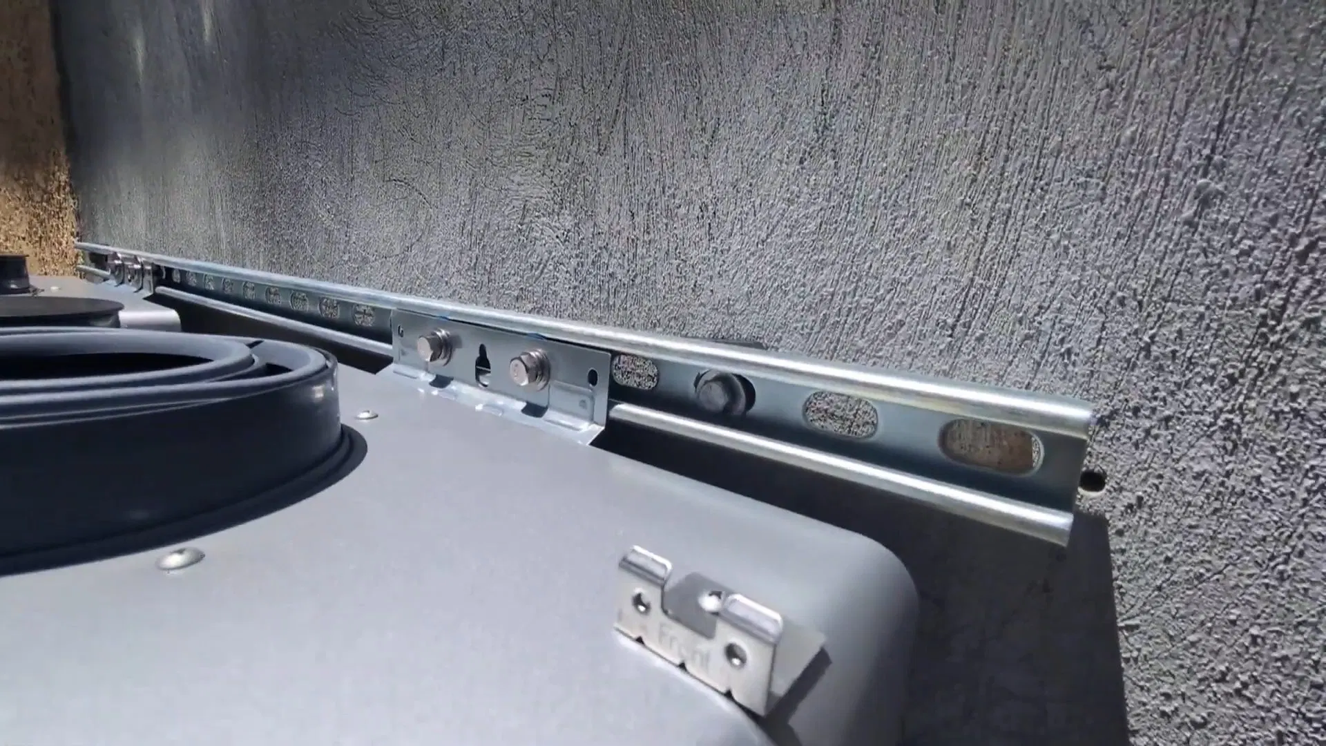 Outdoor Tankless Heater Mounting Bracket shown for Water Heater Installation & Replacement in Dallas, GA in Dallas, Georgia.