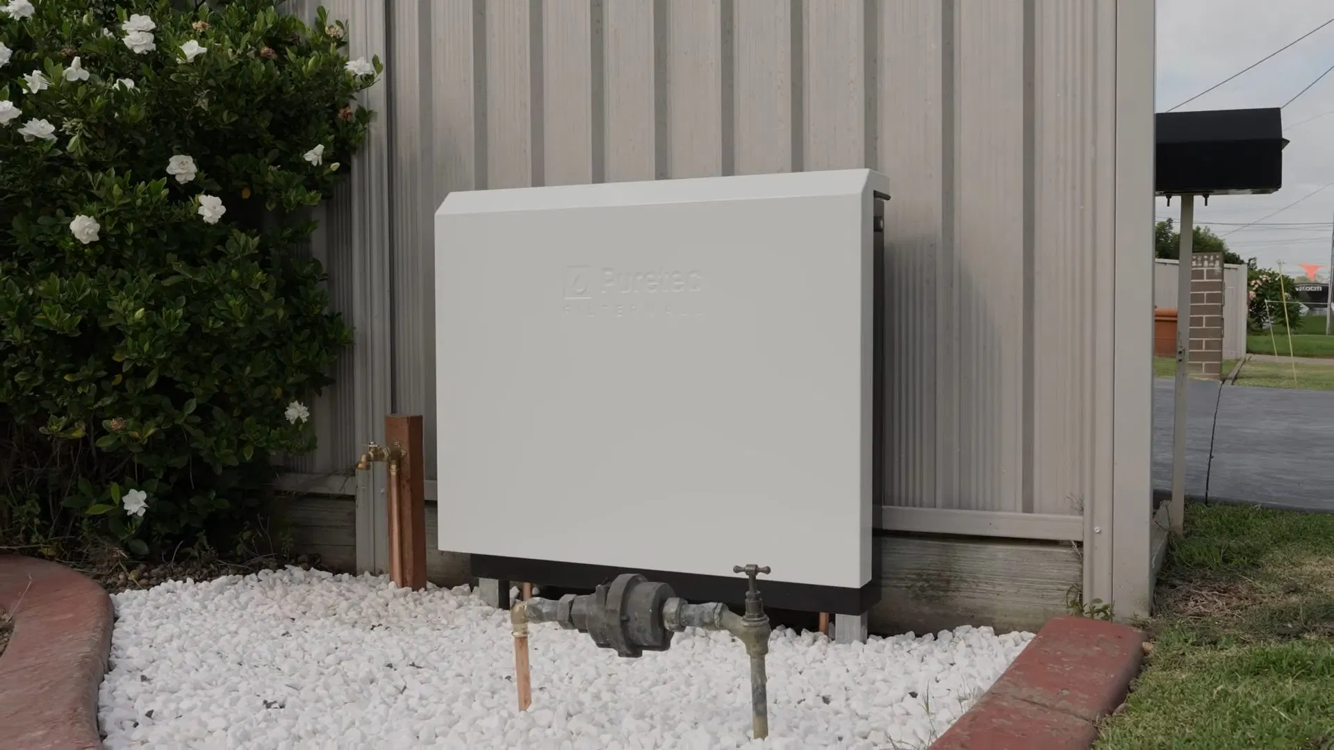 Outdoor Water Filtration Unit After Install shown for Water Softener Installation & Repair in Dallas, GA in Dallas, Georgia.