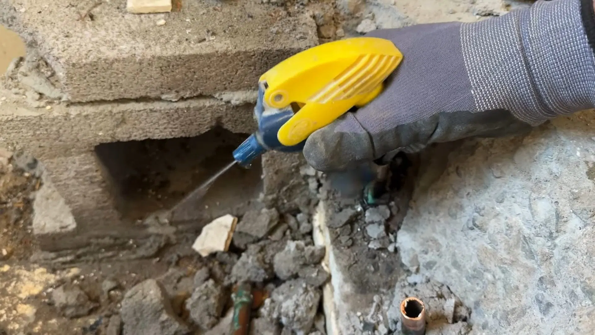 Plumber Breaking Bathroom Tile Floor shown for Toilet Repair & Installation in Dallas, GA in Dallas, Georgia.