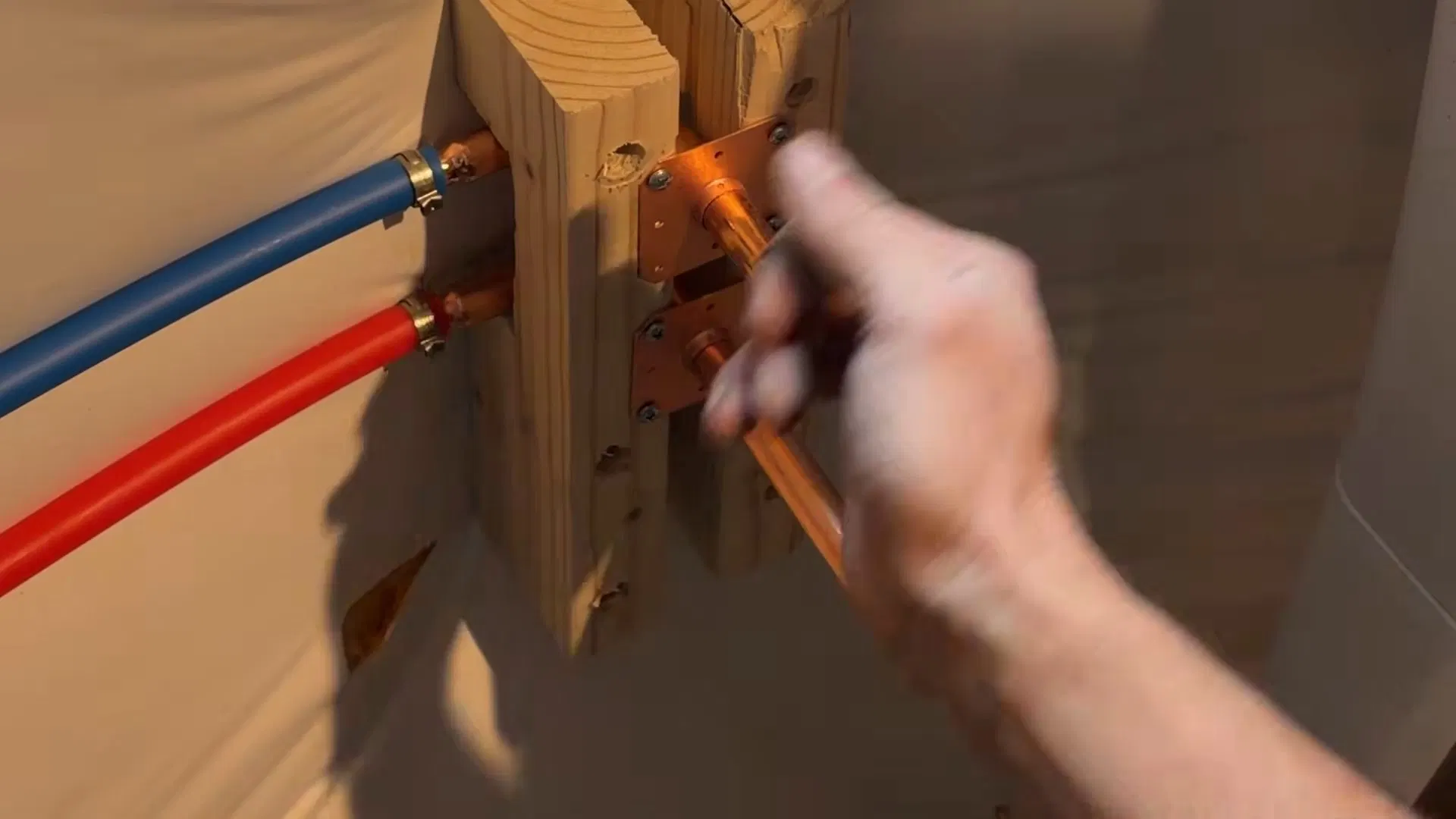 Plumber Measuring Basement Utility Sink Pipe shown for Is Tankless Worth It for a Dallas, GA Home on Propane? in Dallas, Georgia.