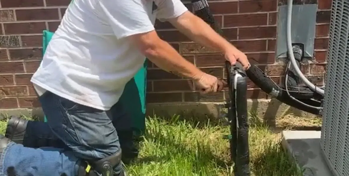 Plumber Opening Backflow Test Port shown for Opening a Restaurant Along Dallas, GA's Highway 61 Corridor: What to Check First in Dallas, Georgia.