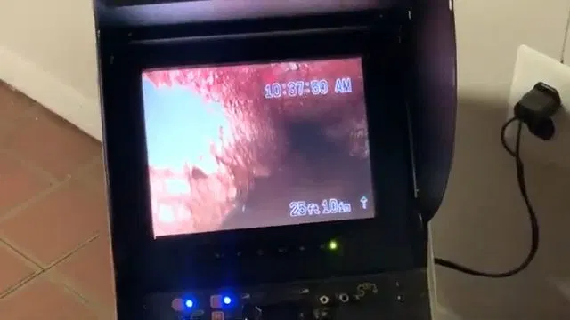 Pointing Out Blockage On Sewer Camera Monitor shown for Sewer Line Repair & Replacement in Dallas, GA in Dallas, Georgia.