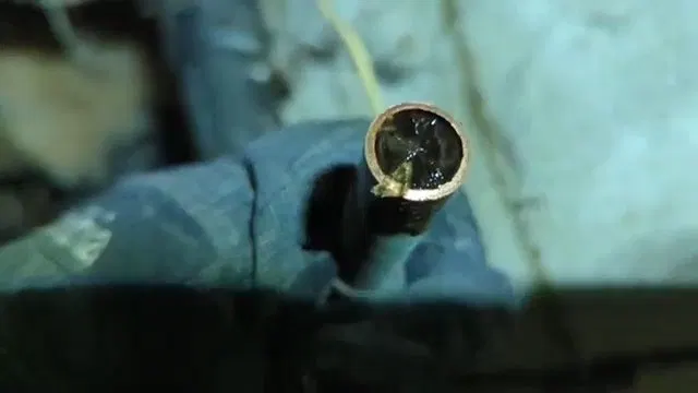 Pointing To Freeze Damaged Copper Line shown for Is Tankless Worth It for a Dallas, GA Home on Propane? in Dallas, Georgia.